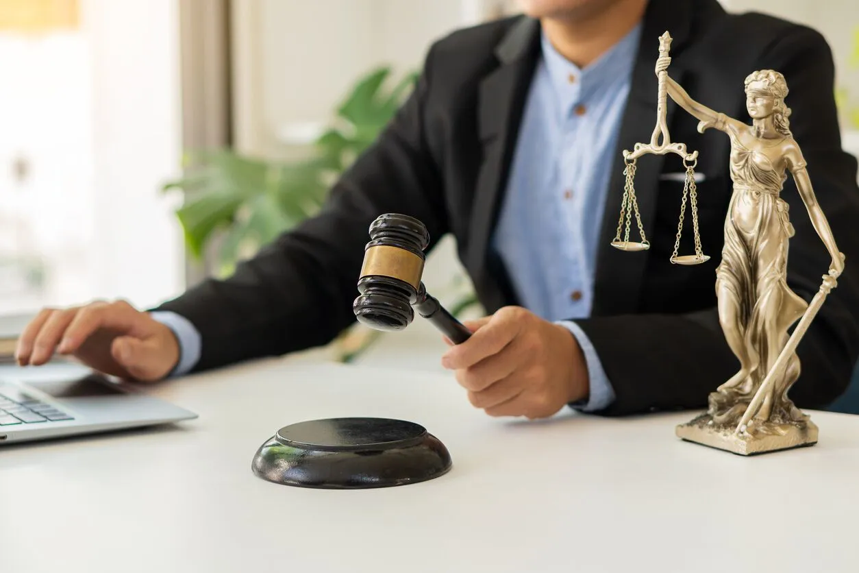Lawyer reviewing legal documents with a client